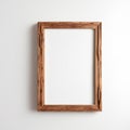 Old rustic wooden vertical picture frame white wall Royalty Free Stock Photo