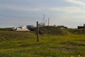 Old rusty abandoned boats, white ships lie on green grassy shore in the light of the sunset. Lake Baikal, Royalty Free Stock Photo