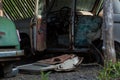 an old rusty abandoned car with its doors open Royalty Free Stock Photo