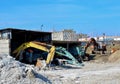 Old rusty abandoned construction excavators with a bucket on the ground