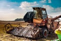 Old rusty abandoned harvester on a country field Royalty Free Stock Photo