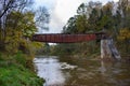 Old rusty, abandoned metal railway bridge over river Royalty Free Stock Photo