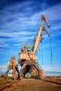 Old rusty abandoned port cranes