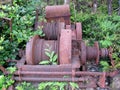 Old rusty abandoned wire winches in the forest Royalty Free Stock Photo