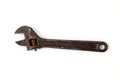 Old rusty adjustable spanner isolated on a white background Royalty Free Stock Photo