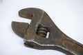 Old, rusty adjustable wrench on a white background close-up Royalty Free Stock Photo