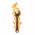 Old rusty adjustable wrench engulfed in bright vertical flames, symbolizing hard work Royalty Free Stock Photo