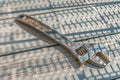 An old and rusty adjustable wrench lies on a wooden table Royalty Free Stock Photo