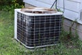 Old Rusty Air Conditioning Unit on Ground in Burlington, Wisconsin Royalty Free Stock Photo