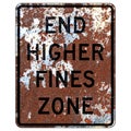 Old rusty American road sign - End higher fines zone