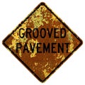 Old rusty American road sign - Grooved pavement