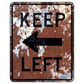 Old rusty American road sign - Keep left arow Royalty Free Stock Photo