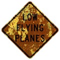 Old rusty American road sign - Low flying planes