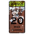 Old rusty American road sign - School speed limit when flashing