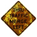 Old rusty American road sign - Thru traffic merge left, California Royalty Free Stock Photo