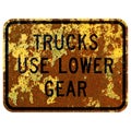 Old rusty American road sign - Trucks use lower gear Royalty Free Stock Photo