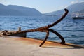 Old rusty anchor ashore