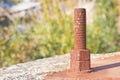 Old rusty anchor bolt with iron plate - image with copy space