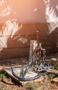 Old rusty anchor on land at the stone wall. Royalty Free Stock Photo