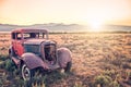 Old rusty antique car, abandoned in a field Royalty Free Stock Photo