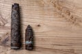 Old rusty artillery shell and aircraft projectile on wooden background, shells bullets of world war 2 found, digged out from the