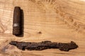 old rusty artillery shell and aircraft projectile on wooden background, shells bullets of world war 2 found, digged out