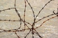 Old rusty barbed wire fence on a beach Royalty Free Stock Photo