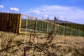 The old, rusty barbed wire hidden in a grass. Rusty old barbed wire with background. Royalty Free Stock Photo