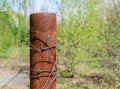 Old and rusty barbed wire on a metal pole. Ghost Town Pripyat. Royalty Free Stock Photo