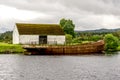 An old rusty barge parked in Caledonian Canal at Fort Augustus, Scotland