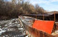 Old rusty barge on a river in the day