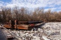 Old rusty barge on a river in the day