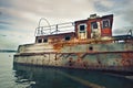 Old rusty barge in the water