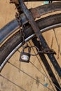 Old rusty bicycle with chain and lock on the wheel Royalty Free Stock Photo