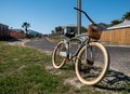 Old rusty bicycle leaning against a street sign post Royalty Free Stock Photo