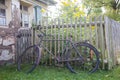 Old rusty bicycle leaning against wooden fence Royalty Free Stock Photo