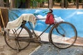 Old rusty bicycle parked against a wall Royalty Free Stock Photo