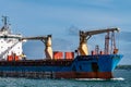 An old rusty big ship is sailing on the sea under a blue sky.The bow of the ship Royalty Free Stock Photo