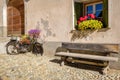 Old bike decorated with gorgeous flowers in S-Chanf Grisons, Switzerland