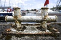 Old rusty bitt on the marina. Royalty Free Stock Photo