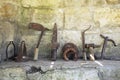 The exhibition of blacksmith craft work examples on the wall in Local Ethnological Museum . Old rusty blacksmith tools