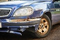 old rusty blue car, front view, sunny day Royalty Free Stock Photo