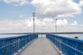 Old rusty blue foot bridge over the road