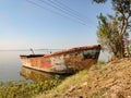 Old fishing boat on lake shore