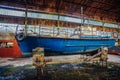 Old rusty boats in hangar in repair factory Royalty Free Stock Photo