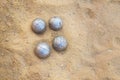 old rusty boccia balls lie on the sand Royalty Free Stock Photo