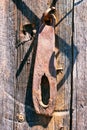 An old rusty bolt on the wooden door. break lock. broken wooden door. Royalty Free Stock Photo