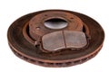 Old rusty brake disc and worn block. Used spare parts for passenger cars Royalty Free Stock Photo