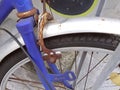 Rusty brakes on blue bicycle