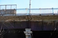 Old and rusty bridge over the railway